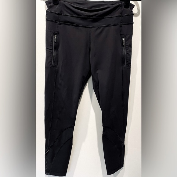 Lululemon Athletica black leggings with mesh details and zipper pockets - Picture 1 of 10